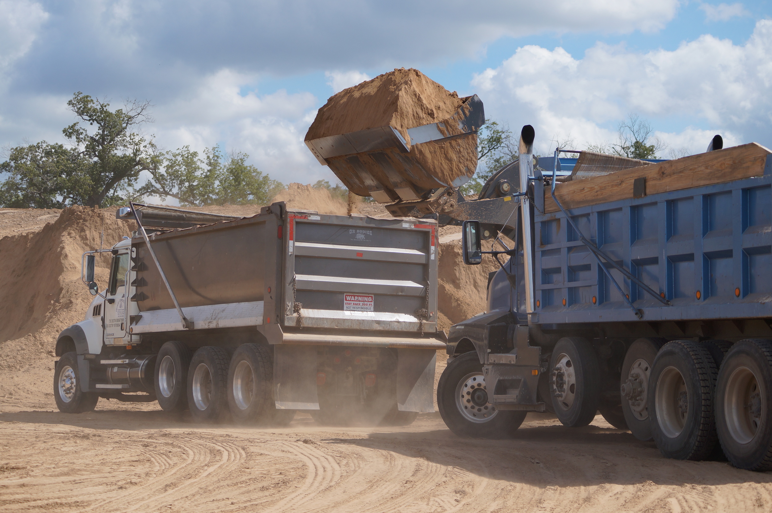 The Benefits and Challenges of Hauling Dirt Offsite